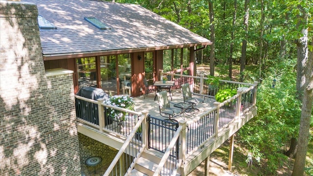 wooden deck with outdoor dining space