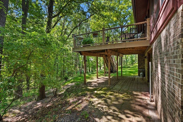 wooden deck featuring stairway