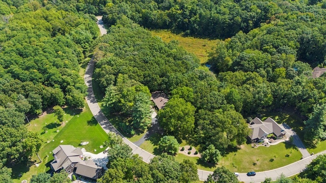 drone / aerial view featuring a view of trees