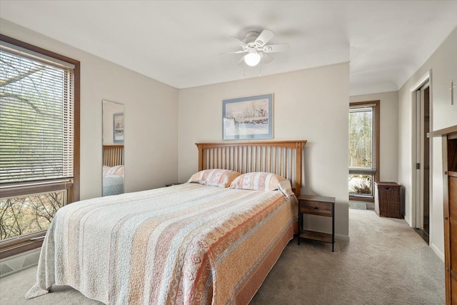 bedroom with carpet floors and a ceiling fan