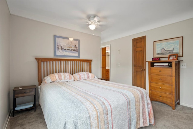 bedroom featuring light colored carpet, baseboards, and ceiling fan