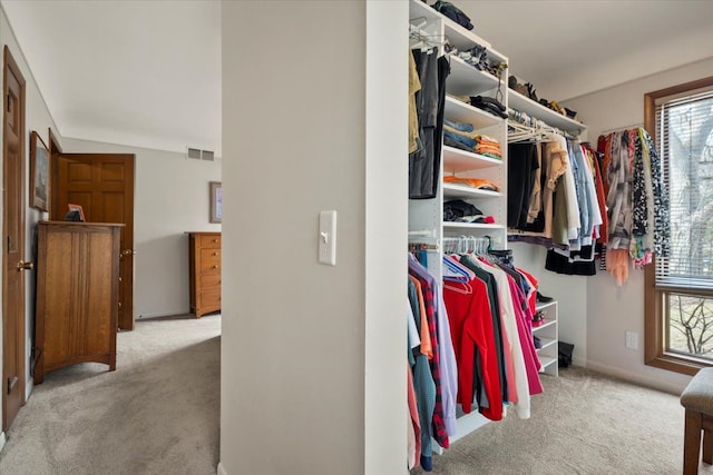 spacious closet with visible vents and carpet floors