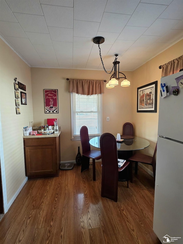 dining room with baseboards and dark wood finished floors