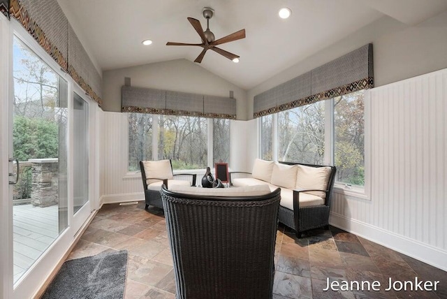 sunroom with lofted ceiling and a ceiling fan