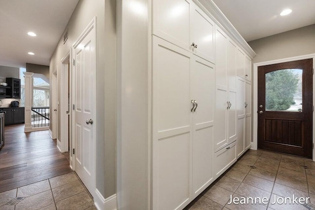 foyer featuring recessed lighting, visible vents, and ornate columns