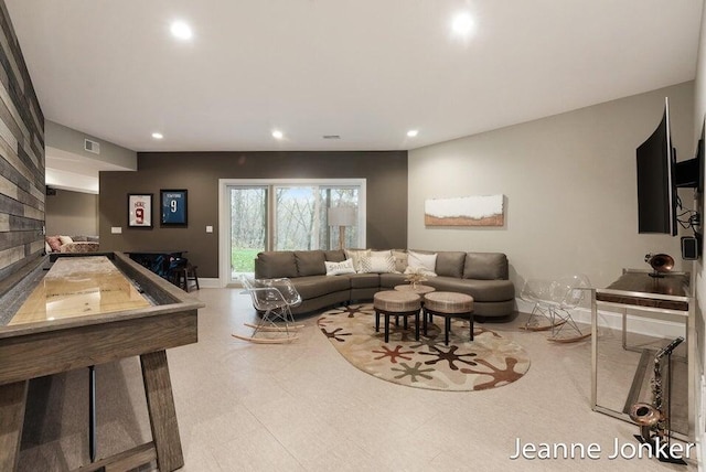 living area with tile patterned floors, visible vents, recessed lighting, and baseboards