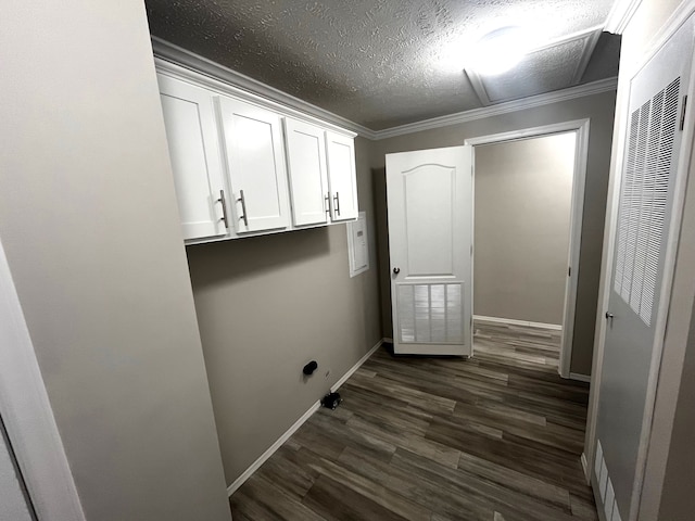 washroom featuring a textured ceiling, dark wood-style floors, crown molding, baseboards, and a heating unit