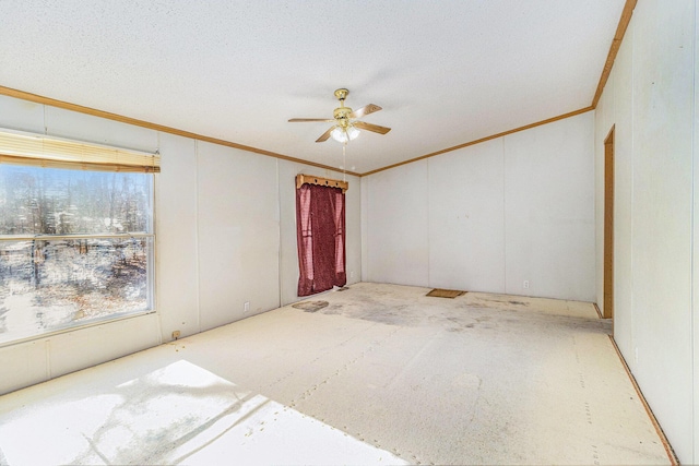 empty room featuring crown molding, a ceiling fan, and a textured ceiling