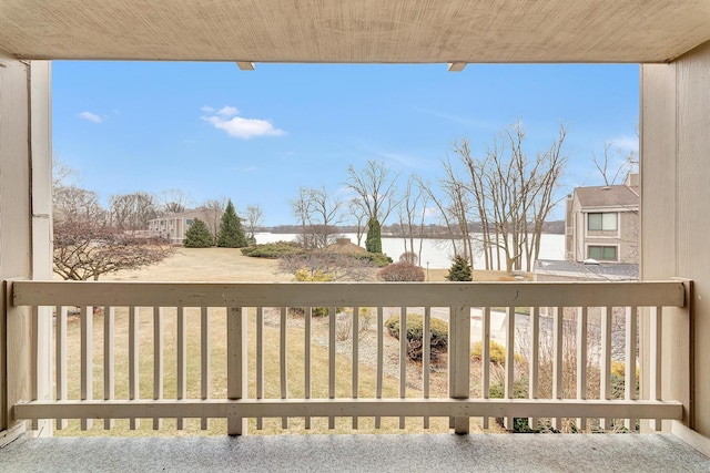 balcony featuring a water view