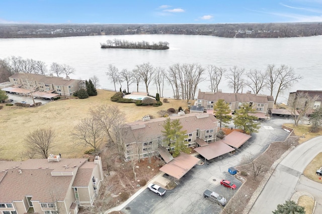 birds eye view of property featuring a water view