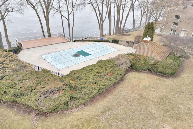 view of yard featuring a patio, fence, and a fenced in pool