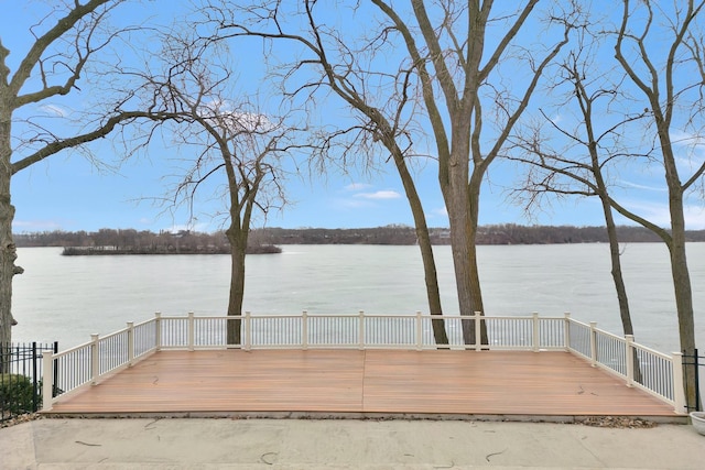 dock area featuring a deck with water view