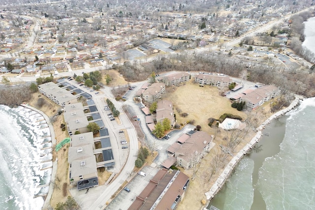 aerial view with a residential view and a water view