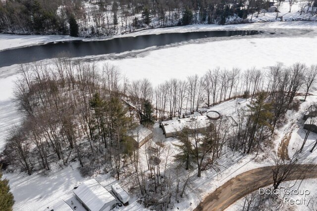 snowy aerial view featuring a water view