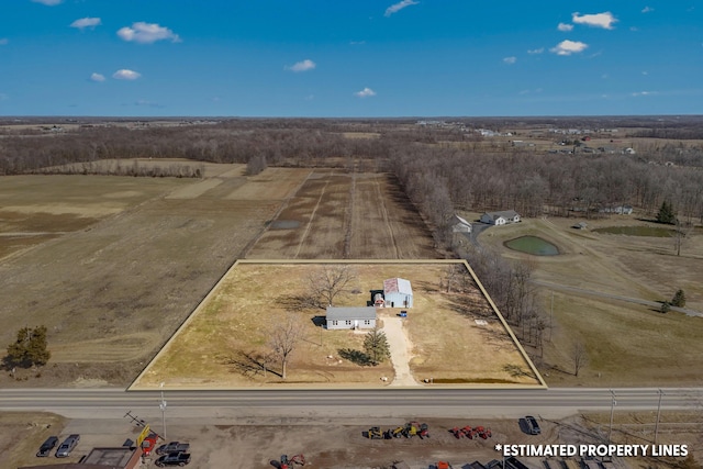 birds eye view of property with a rural view