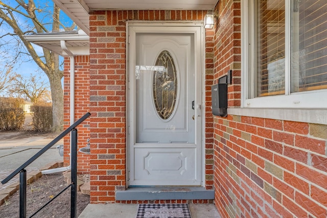 entrance to property with brick siding