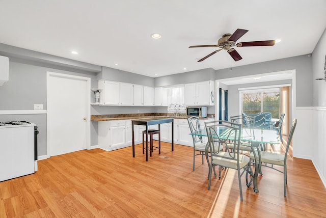 dining area featuring recessed lighting, ceiling fan, and light wood finished floors