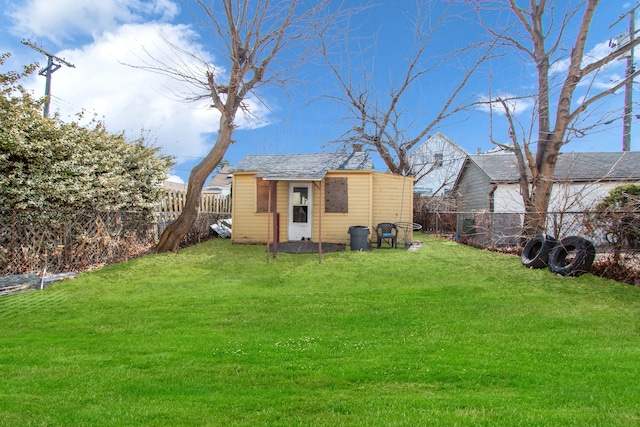 view of yard featuring an outbuilding and a fenced backyard