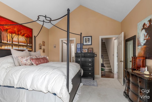 bedroom with carpet flooring and vaulted ceiling