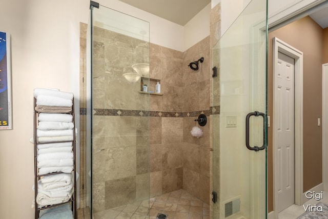 full bathroom featuring visible vents and a shower stall