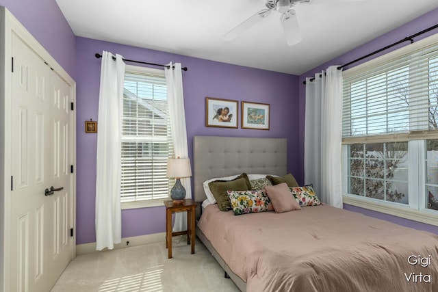 bedroom featuring carpet flooring, baseboards, and a ceiling fan