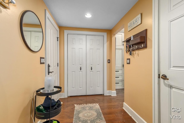 entrance foyer with recessed lighting, baseboards, and dark wood-style floors