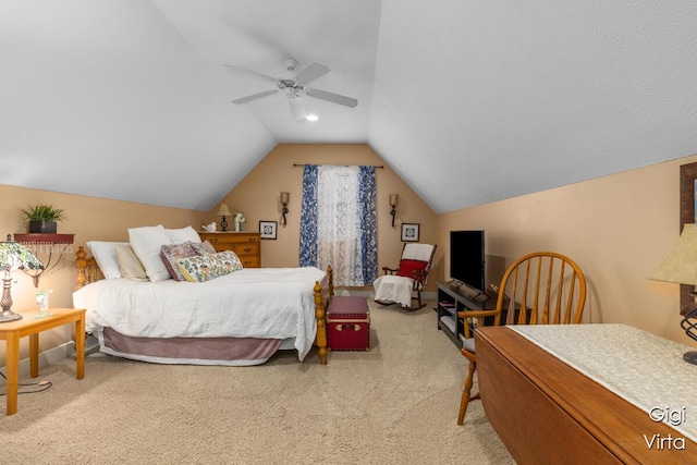 bedroom with carpet, a ceiling fan, and vaulted ceiling