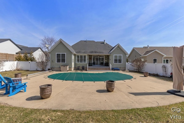 view of swimming pool featuring a patio area, a fenced in pool, a fenced backyard, and an outdoor fire pit