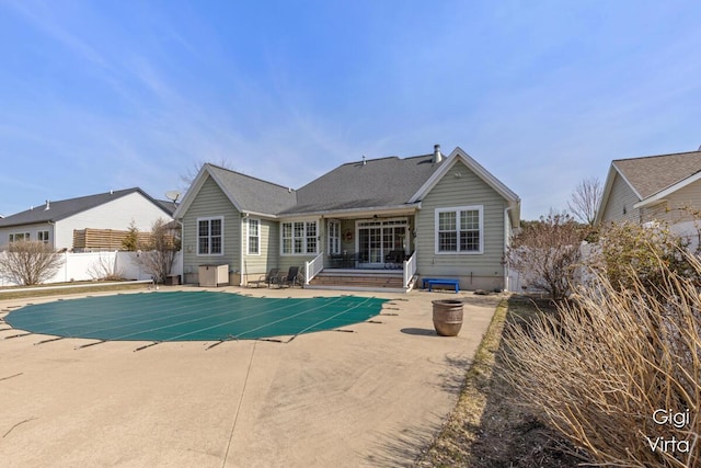 view of pool with a patio area, a fenced in pool, and fence