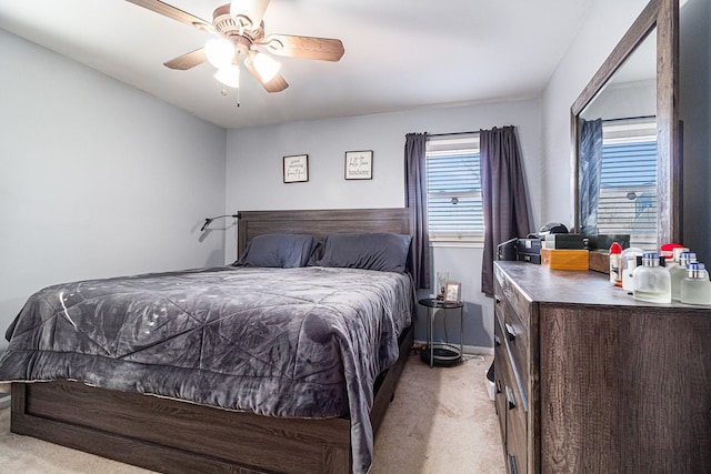 carpeted bedroom with a ceiling fan