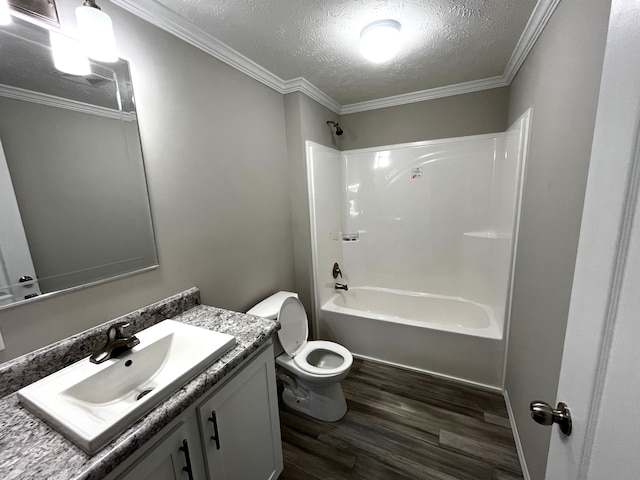 bathroom with vanity, wood finished floors, shower / washtub combination, a textured ceiling, and toilet