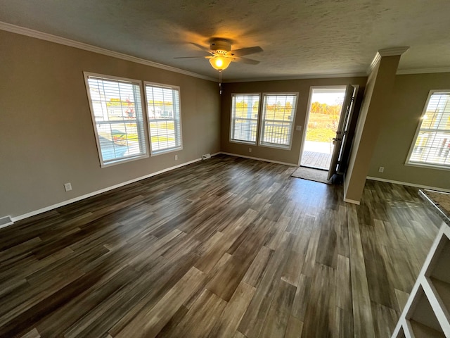 interior space with ornamental molding, ceiling fan, baseboards, and dark wood-style flooring