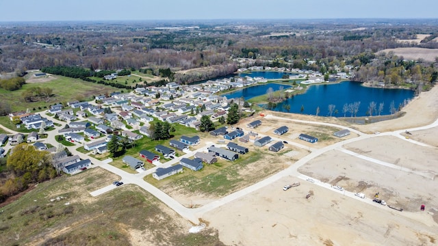 birds eye view of property with a residential view and a water view