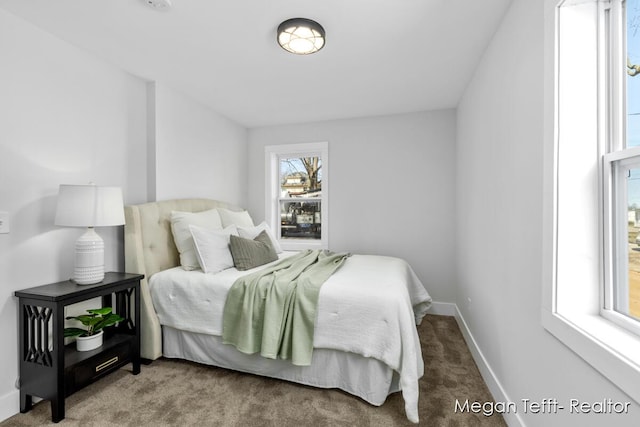 bedroom with carpet flooring and baseboards