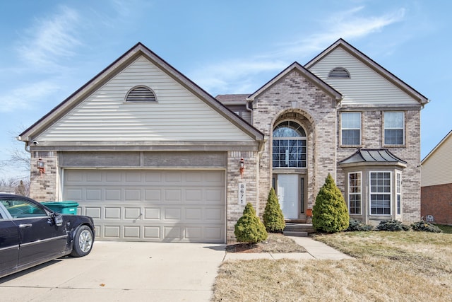 traditional-style home featuring brick siding, concrete driveway, and a garage