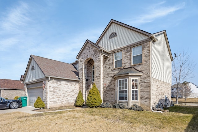 traditional home with a front lawn, an attached garage, brick siding, and driveway