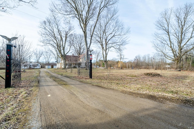 view of street with dirt driveway