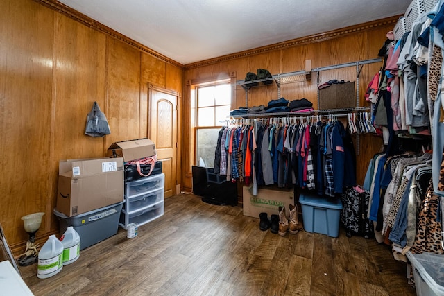 walk in closet with wood finished floors