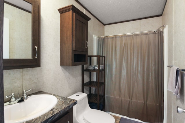 bathroom with vanity, crown molding, toilet, and a textured ceiling