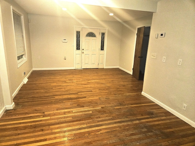 unfurnished room featuring dark wood finished floors and baseboards