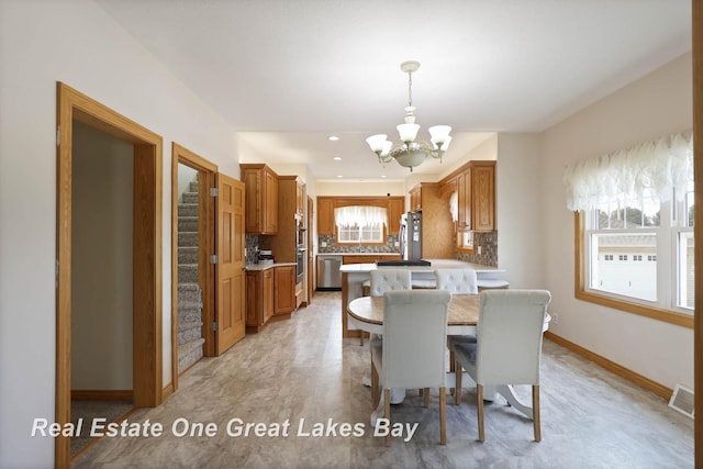 dining room with visible vents, baseboards, a chandelier, stairs, and recessed lighting