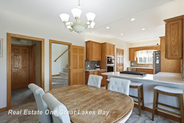 dining room with stairway, recessed lighting, baseboards, and an inviting chandelier