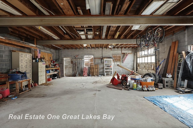 garage featuring concrete block wall