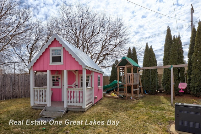 exterior space with an outbuilding and a playground