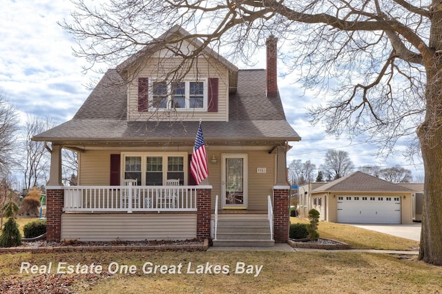 view of front facade featuring covered porch, a shingled roof, a chimney, an outdoor structure, and a garage