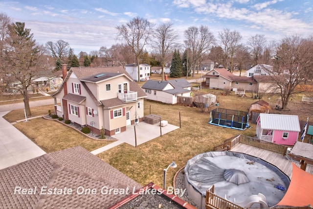 birds eye view of property with a residential view