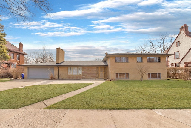 view of front of property featuring brick siding, an attached garage, a front lawn, a chimney, and driveway