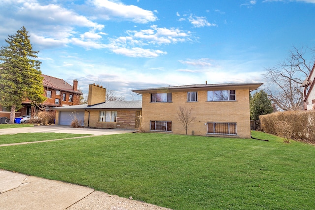 view of front facade featuring driveway, a chimney, a front lawn, a garage, and brick siding