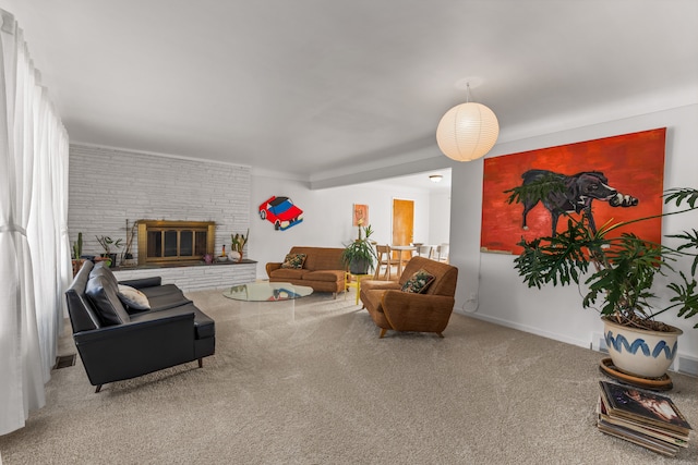 living area with a brick fireplace and carpet floors