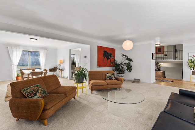 living room with baseboards and carpet